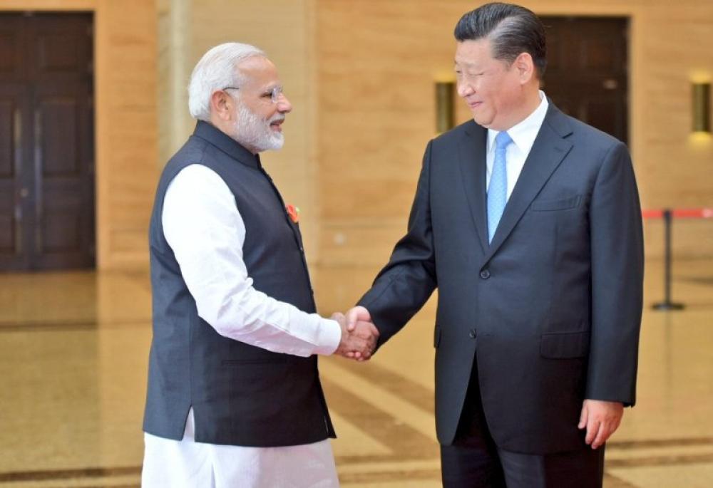 Narendra Modi, Xi Jinping meet in Wuhan, exchange views on solidifying bilateral relationship 