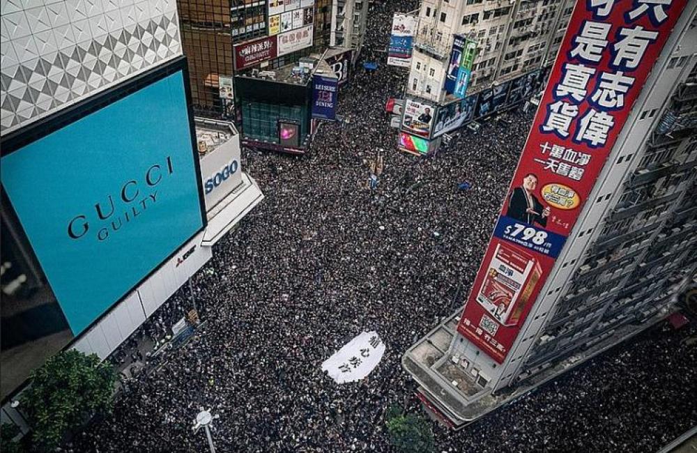 Hong Kong police use tear gas to disperse protesters in city's Northwest