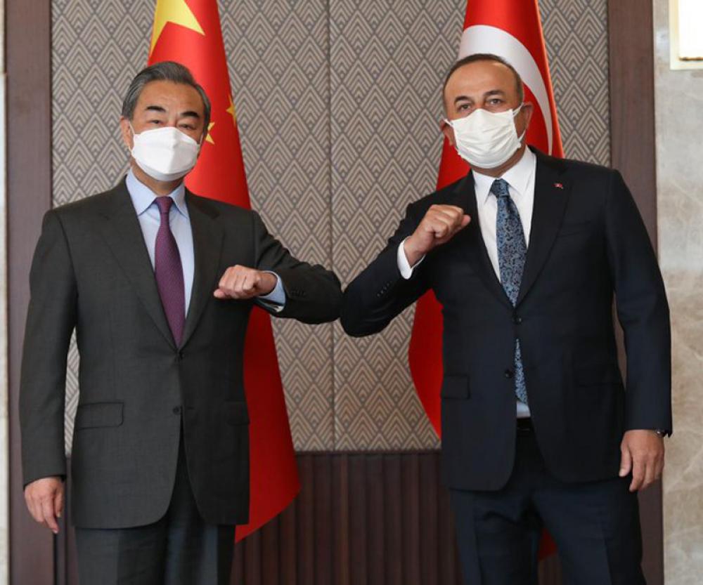 Turkish Foreign Minister Mevlut Cavusoglu raises 'Uyghur' issue during his meeting with China's Wang Yi 