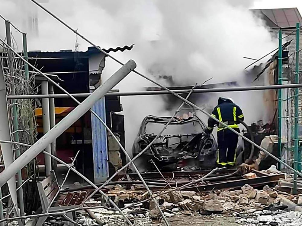 Emergency service staff of Ukraine during rescue operation after a building was hit by heavy shelling on the 13th day of Russian 