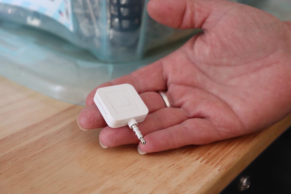 Sanders offers Square as an option for payment at her hair salon. Square is a financial services platform to help small-and medium-sized businesses to accept credit card payments and use phones or tablets as payment registers for a point-of-sale system. Photo by Julianna M. Russ