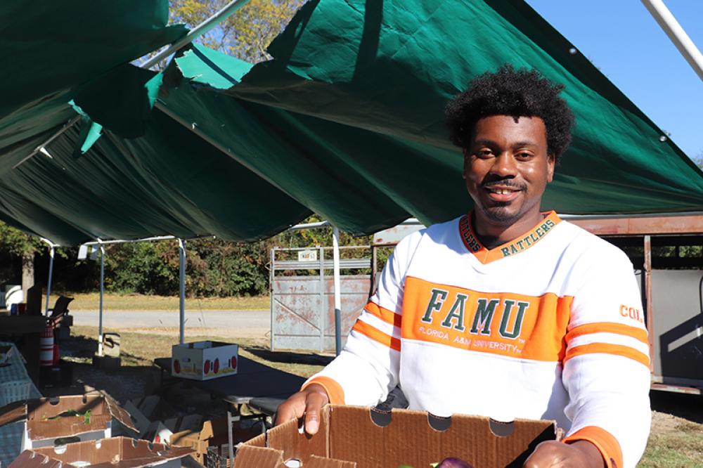 Kendall Strickland is the owner of Strickland Pride Produce in Lexington, Ga. Most of his buyers pay with cash. Photo by Julianna M. Russ