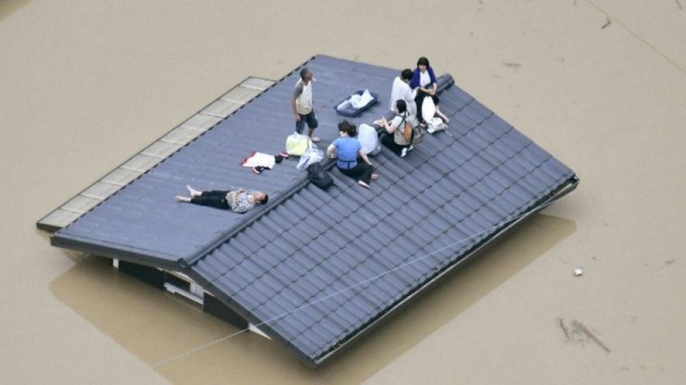 At least 94 dead as heavy rain inundates Japan