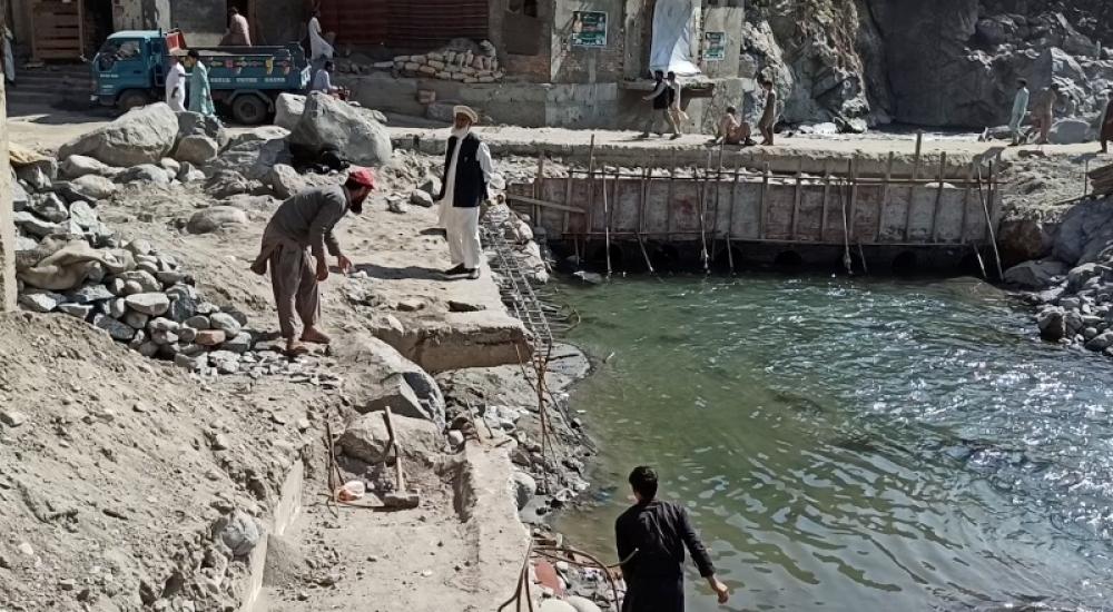 Locals survey the damage in the wake of floods in Swat