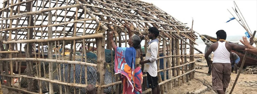 People rebuilding a house after destruction caused due to Cyclone Fani in 2019 when it hit Puri in Odisha. Due to rising marine heatwaves, cyclones are likely to intensify. Photo by Nidhi Jamwal.