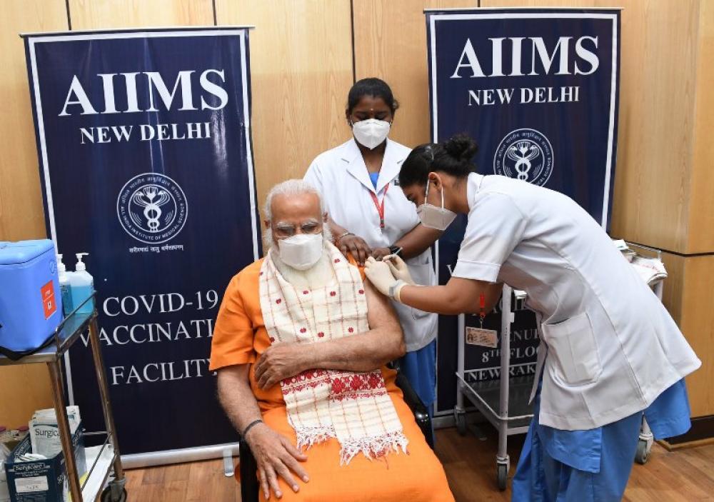 File image of Indian PM Modi taking second dose of Covid vaccine in April. Photo via PIB India.