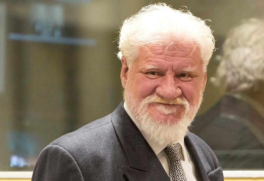 Bosnian war criminal drinks poison inside court, dies