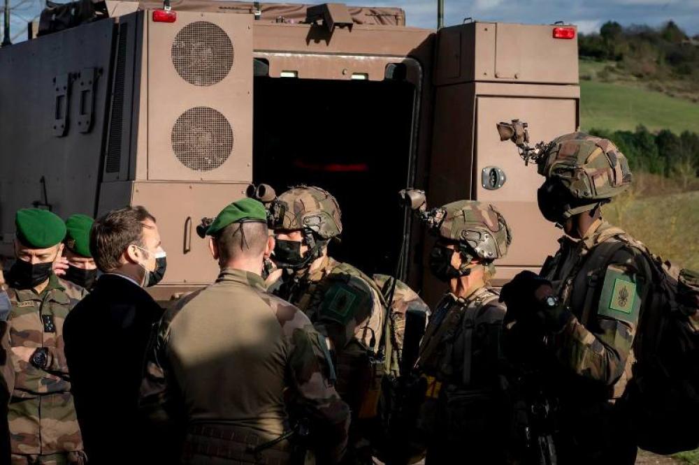 File photo: Macron interacting with French troops in Castelnaudary in southern France clicked in March this year. Image credit: Facebook/Emmanuel Macron