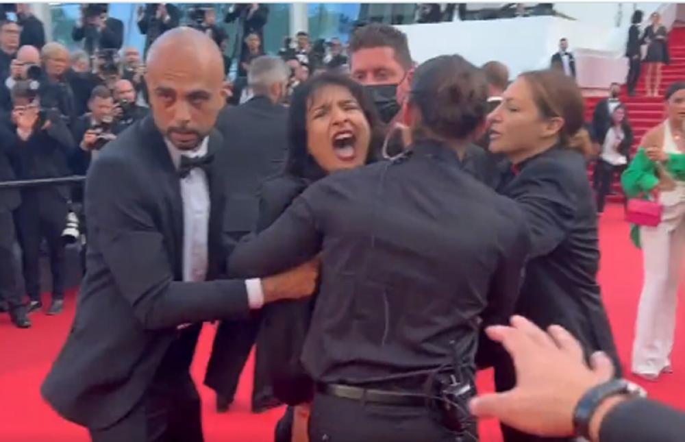 'Topless' woman crashes Cannes Red Carpet to protest against sexual violence in Ukraine, removed