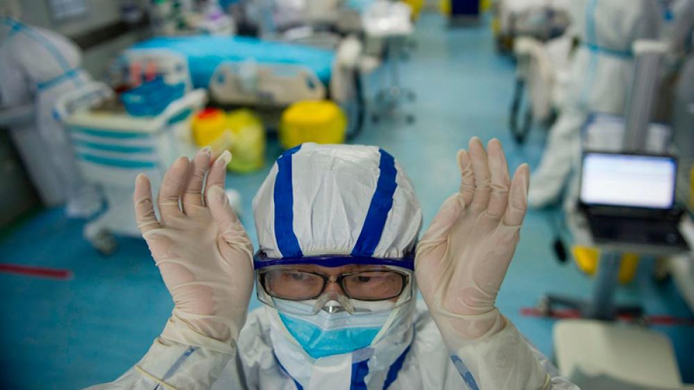 China’s ‘exhausted’ doctors and nurses working long hours for reduced pay amid COVID-19 surge