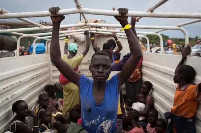 Over 26,000 people flee South Sudan into Uganda; influx sets single-day record Over 26,000 people flee South Sudan into Uganda; influx sets single-day record