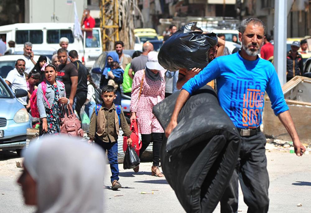 People return to homes in Syria’s southern province