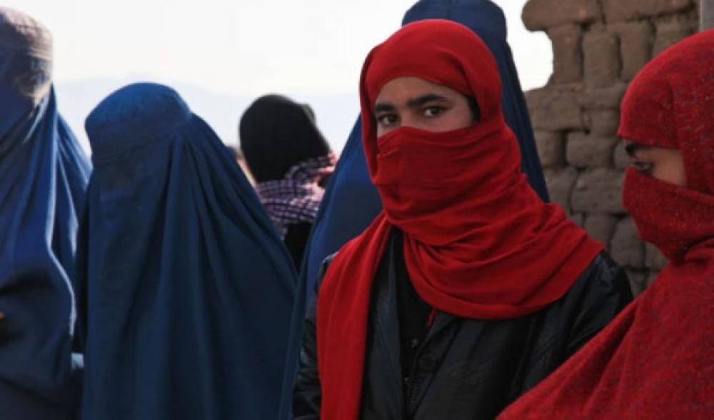As Taliban whitewashes picture of woman in Kabul observers fear about safety and rights of women in new Afghanistan